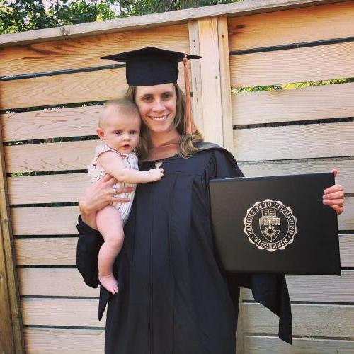 women holding baby and degree
